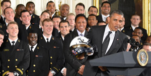 President Obama accepts Navy Midshipmen's helmet